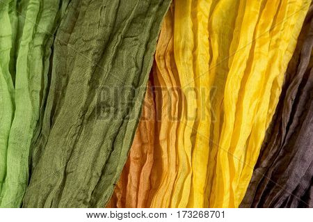 green and orange shirred fabric silk texture multi-colored