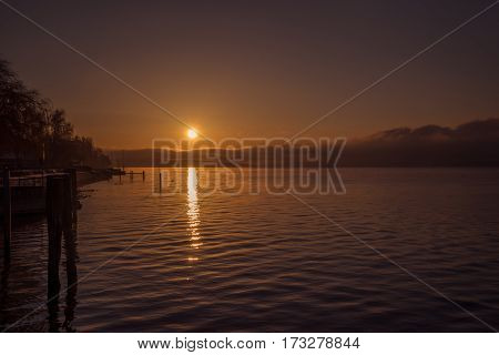 A calm sunset on the shore of a lake in germany