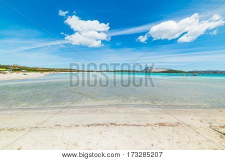 cumulus clouds over Lu Impostu beach Sardinia