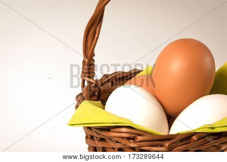 Eggs in wicker basket from green napkins