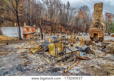 GATLINBURG TENNESSEE/USA - DECEMBER 14 2016: A tourist cabin that has been burned to the ground by a forest fire in Gatlinburg in late 2016.
