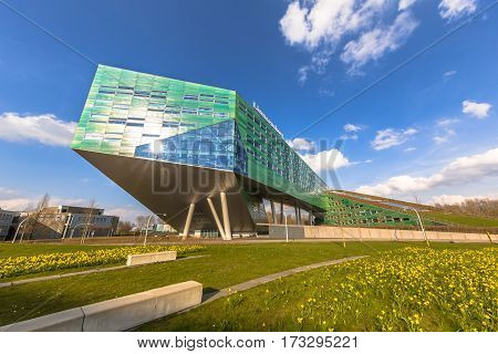 GRONINGEN NETHERLANDS - APRIL 4 2016: Reflection of sun in Linnaeusborg life sciences faculty building on Zernike complex of Groningen University