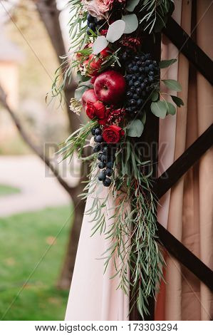 Autumnal Wedding Composition Of Roses, Apples, Grape And Pomergranate, In Red Colour, Closeup