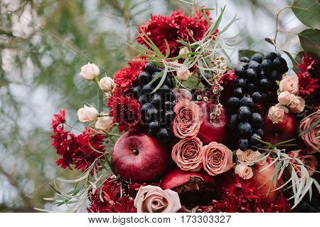 Autumnal Wedding Composition Of Roses, Apples, Grape And Pomergranate, In Red Colour, Closeup