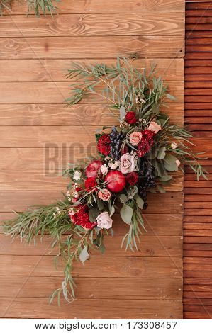Decoration Of Autumnal Composition Of Roses, Apples, Grape And Pomergranate On Wooden Background