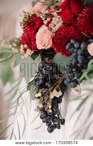 Autumnal Wedding Bouquet Of Roses, Apples, Grape And Pomergranate, In Red Colour, Closeup
