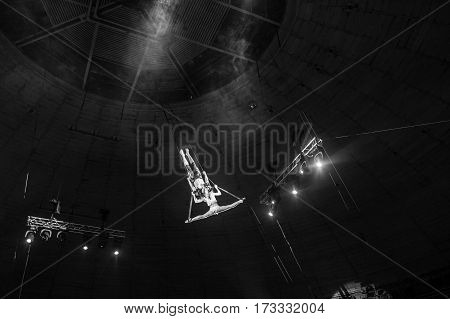 Stunt aerialists men and women in the circus. Love, danger, and romance concept.
