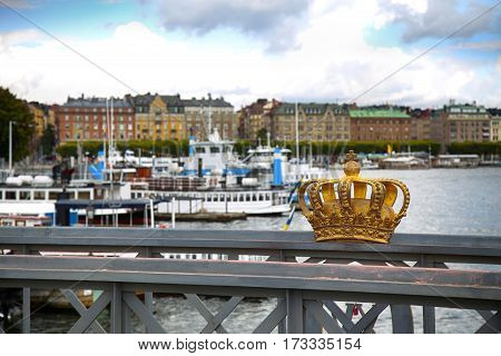 Skeppsholmsbron (Skeppsholm Bridge) with Golden Crown on a bridge in Stockholm Sweden