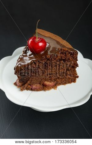 Chocolate cake with juicy cherries