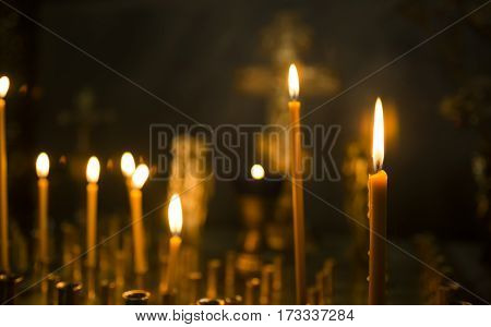 sacred burning candles in the church. Church candles background. Selective focus