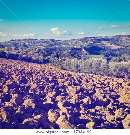 Small Medieval Italian City in Tuscany Surrounded by Plowed Fields Vineyards and Olive Groves Instagram Effect