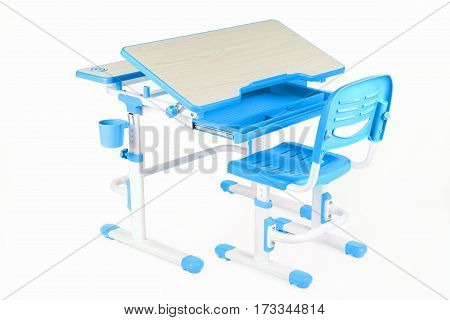Blue chair and school table on the white isolated background.
