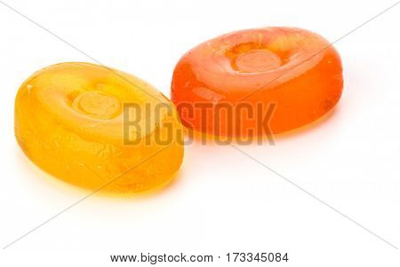 Two colorful fruit hard sugar candies,  boiled sweeties or sugar plums isolated on white background cutout