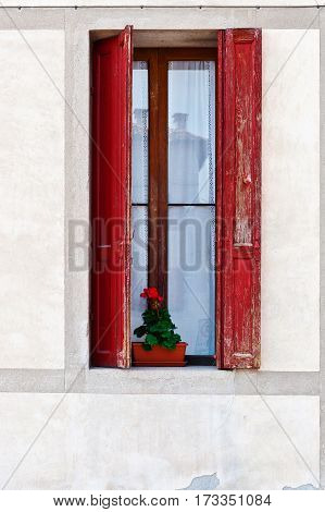 Window on the Facade of the Restored Italian Home