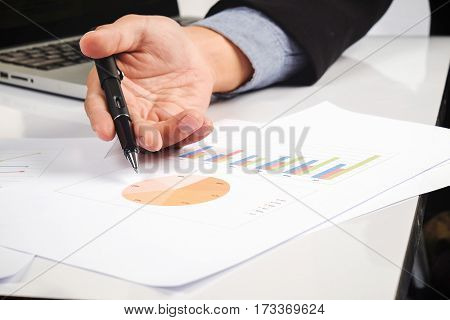 Business Man Hand Pointing At Business Document During Discussion At Meeting