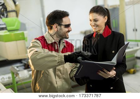 Inspector And Carpenter Discuss The Process Of Making Wood Products For Furniture