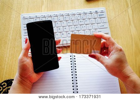 Woman's Hands Holding Credit Card And Using Laptop. Online Shopping
