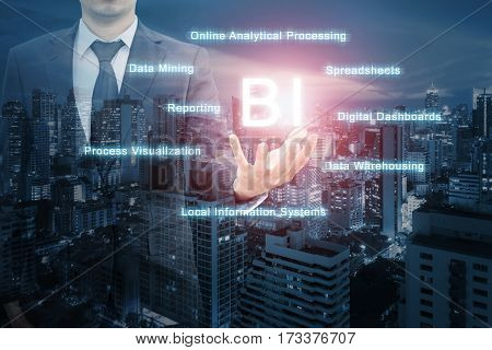 Double Exposure Of Professional Businessman With Night Cityscape In Blue Tone Hold Text Bi ( Busines