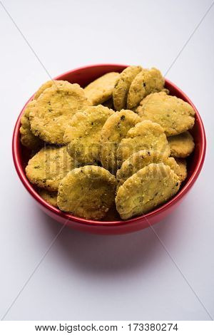 Tasty North Indian snack mathri or mathari served with pickle. Selective focus photograph.