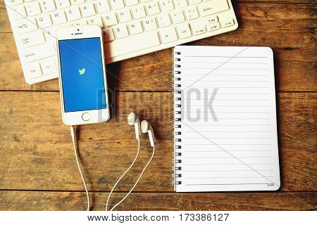 CHIANGMAI THAILAND -Aoril 14 2016: Apple iPhone open Twitter applicationTwitter is an online social networking and microblogging service that enables users to send and read 