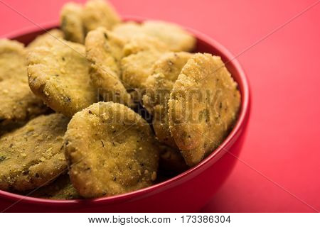 Tasty North Indian snack mathri or mathari served with pickle.Selective focus photograph.