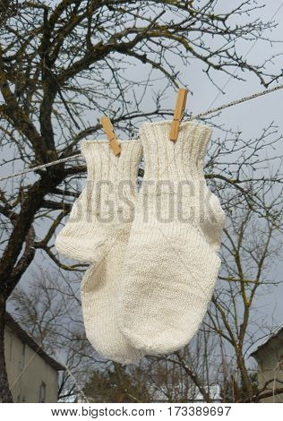 Thick warm socks drying on a clothesline