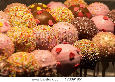Cakepops decorated with candy melt and chocolate presented for a kid's birthday treat