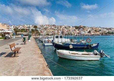 SITIA, CRETE, GREECE - JUNE 2016: Seaport of Sitia town with moored traditional Greek fishing boats