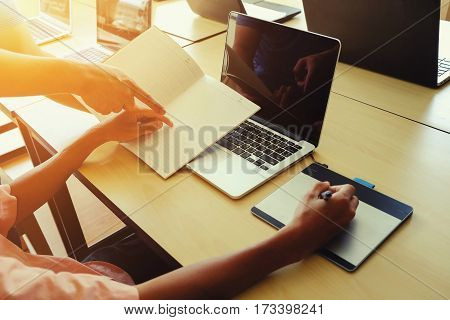 The above view of young man dicussing data at meeting