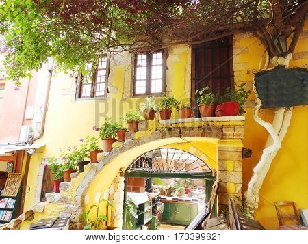 door architecture detail in house building with bougainvillea Greece
