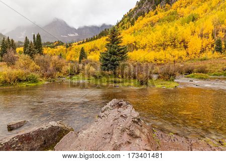 a scenic fall landscape during a storm at the maroon bells near Aspen Colorado