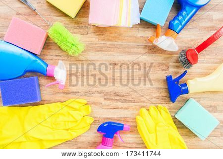 Spring cleaning concept - colorful spays and rubbers frame