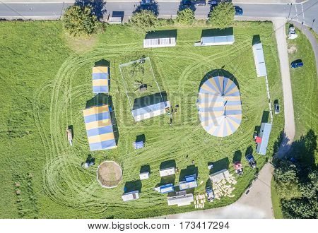 Aerial view of a circus tent with cage of white tigers