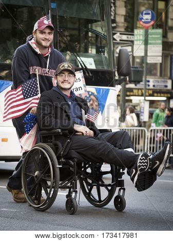 NEW YORK - 11 NOV 2016: A vet in a wheelchair takes part in the annual Americas Parade produced by the United War Veterans Council UWVC on 5th Avenue on Veterans Day in Manhattan.