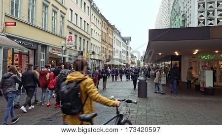 Trier, Germany - October, 20, 2016: Old city street with shops and malls in Trier, Germany. People pedestrians and tourists are passing by.