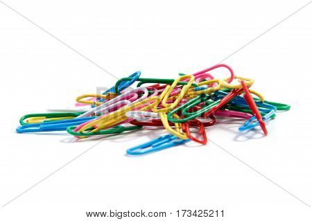 Bunch of colorful paper clips on white backgrpund