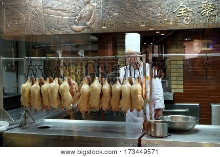 BEIJING - FEBRUARY 22: Chefs prepare duck roasting in the original Quanjude restaurant at the Qianmen street in Beijing, China, February 22, 2016.