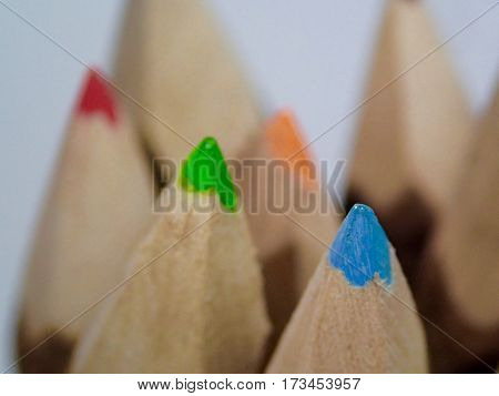 Vibrant colored pencil tips appear like mountain  peaks.