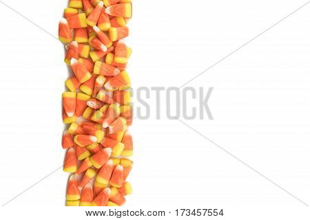 Candy Corns in Vertical Row on Isolated White Background