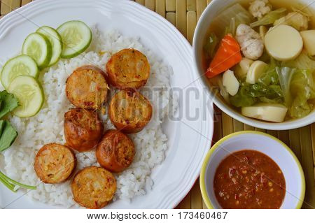 Thai tradition pork sausage and spicy shrimp paste with egg tofu soup