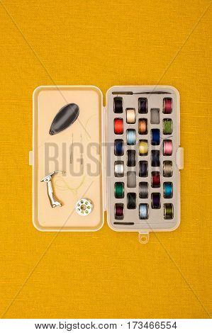 Different Color Thread In Bobbins And Other Sewing Machine Parts