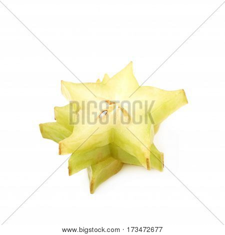Pile of sliced carambola starfruit fruits isolated over the white background