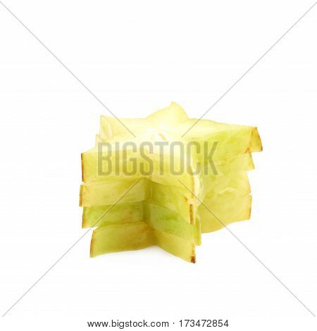 Pile of sliced carambola starfruit fruits isolated over the white background