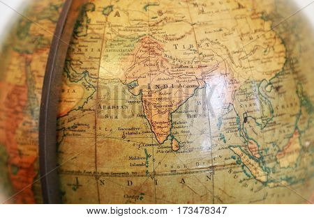 Scenery with India of the old terrestrial globe