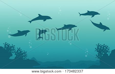 Silhouette of family dophin on sea landscape vector art