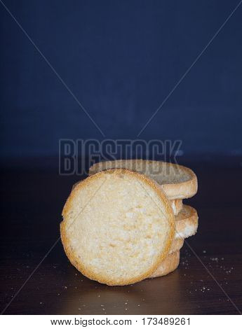Pile of Dutch beschuits on blue dark background