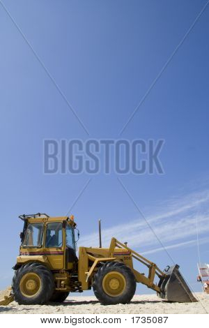 Bulldozer på stranden