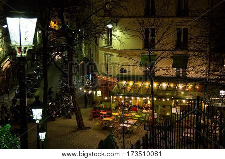 PARIS, FRANCE - February 28, 2015: Artistic cafe by night on Montmartre.