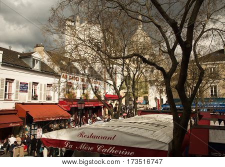 PARIS FRANCE - APRIL 16 2016: Basilica of Sacre Coeur and Place du Tertre on Montmartre.