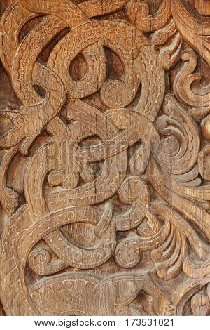 Norwegian ancient wooden carving. Nature forms. Heddal church. Norway. Vertical